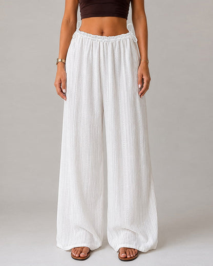 Pantalón liso, con bolsillos, con cordón ajustable, con bajo de volante