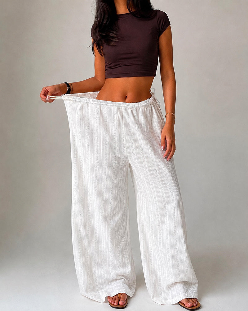 Pantalón liso, con bolsillos, con cordón ajustable, con bajo de volante